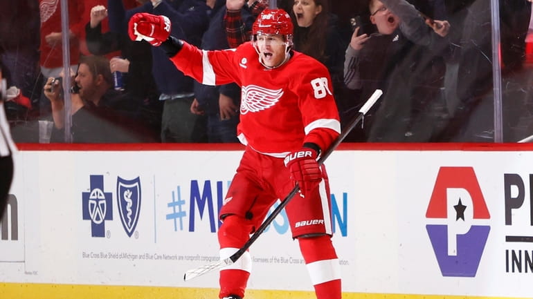 Detroit Red Wings right wing Patrick Kane celebrates his overtime...