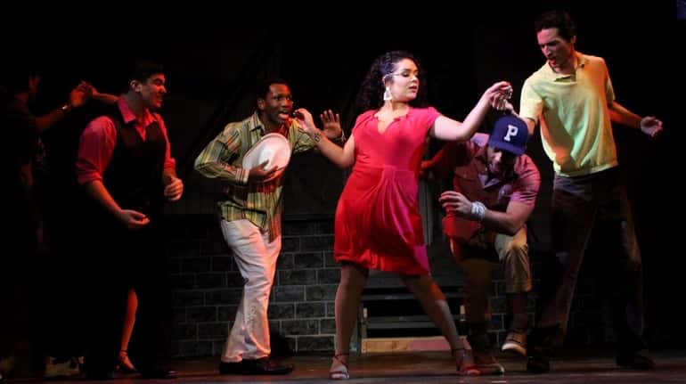 Samantha Rosario, center, plays Vanessa in "In the Heights" at...