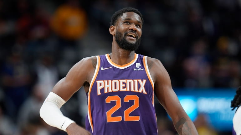Phoenix Suns center Deandre Ayton looks on during the second...