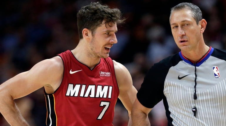 Miami Heat's Goran Dragic talks with official JT Orr during...