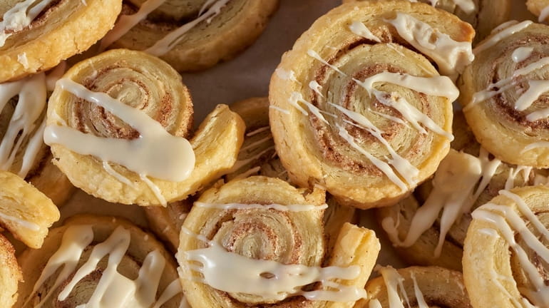 Cinnamon spiral cookies with vanilla frosting.