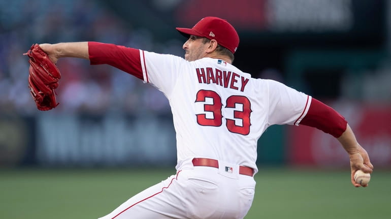 Los Angeles Angels starting pitcher Matt Harvey throws during the...