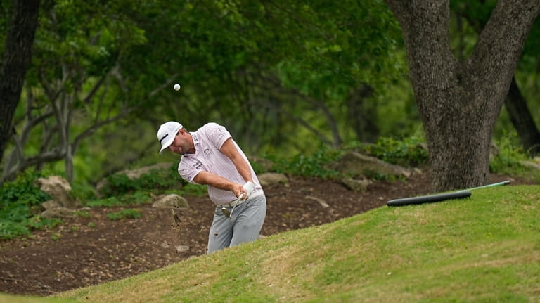 Taylor Montgomery plays a shot from the rough during the...