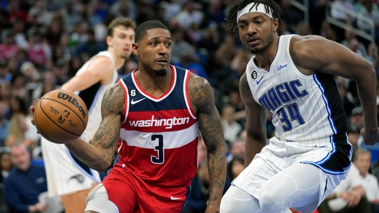 Washington Wizards' Bradley Beal (3) makes a move to get...