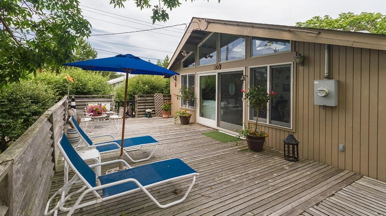 Priced at $849,000, this three-bedroom, two-bathroom wood-sided bungalow in the...