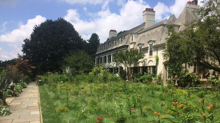 The flowery lawn next to Chanticleer House is a whimsical...