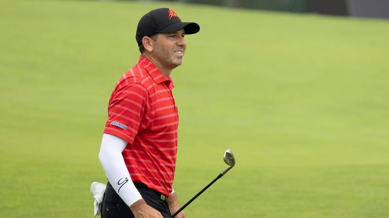 Captain Sergio Garcia looks on from the 18th fairway during...