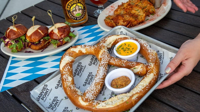 The “ Giant Pretzel” with beer cheese sauce and spicy...
