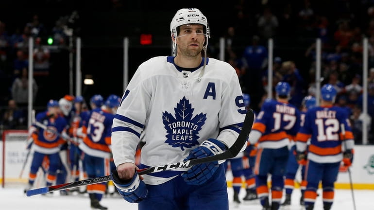 John Tavares #91 of the Toronto Maple Leafs skates off...