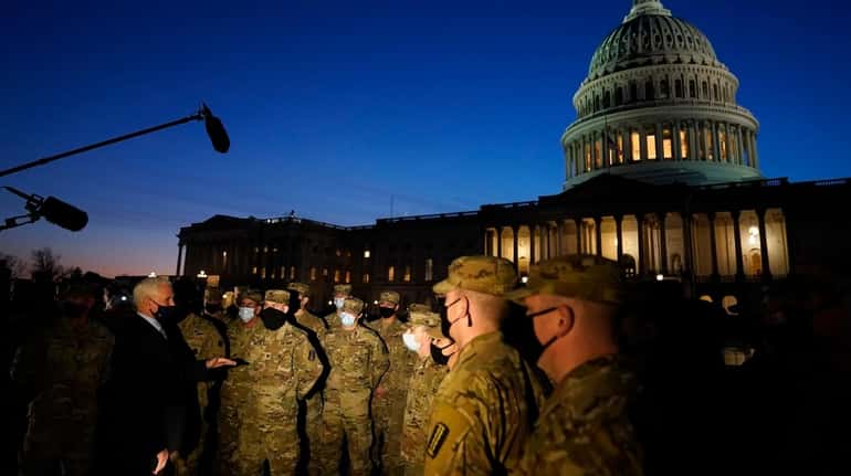 Vice President Mike Pence speaks to National Guard troops outside...