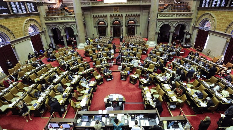 Members of the New York Assembly work on passing legislation...