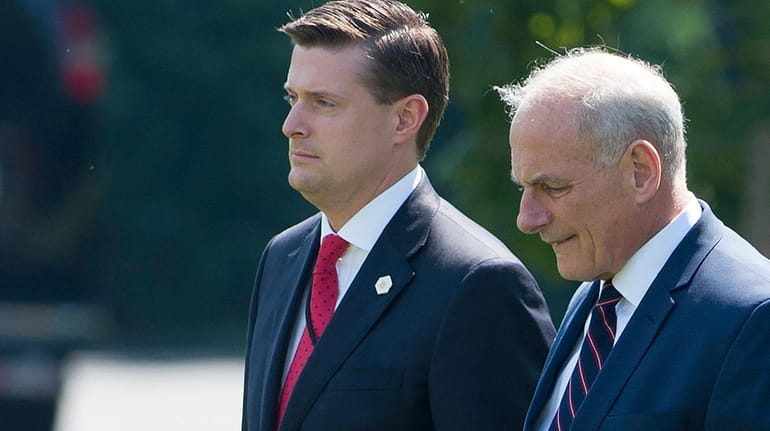 Then-White House staff secretary Rob Porter, left, and chief of...