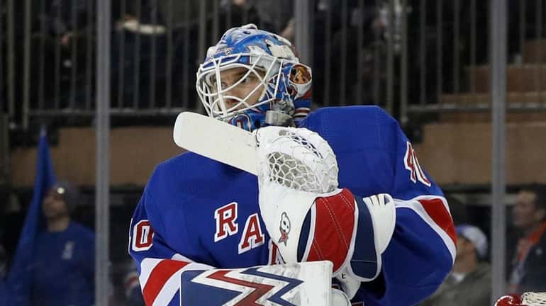 Alexandar Georgiev of the Rangers looks on after surrendering a...