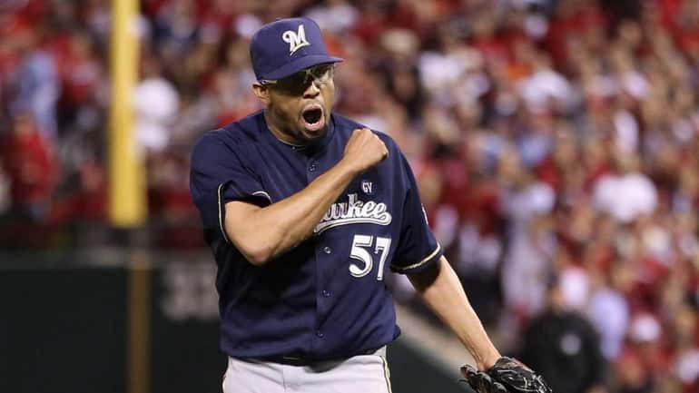 Francisco Rodriguez of the Milwaukee Brewers reacts after he struck...