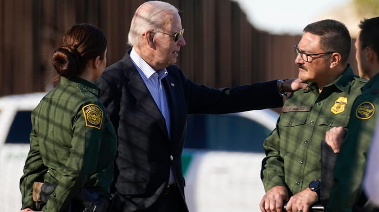 President Joe Biden talks with U.S. Border Patrol agents as...