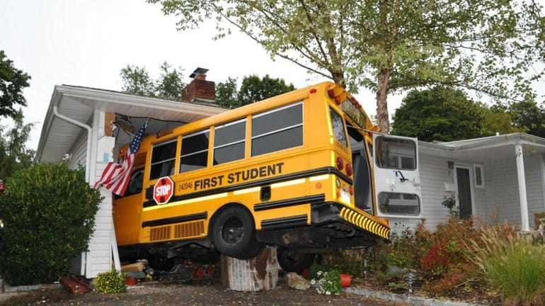 The driver of a school bus carrying five children crashed...