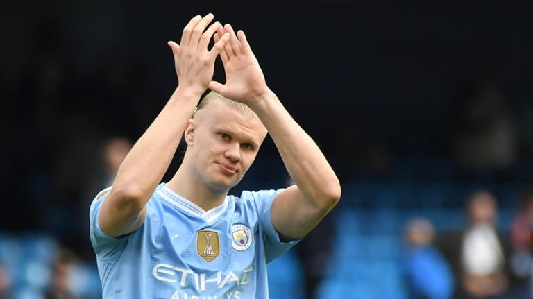 Manchester City's Erling Haaland applauds fans at the end of...