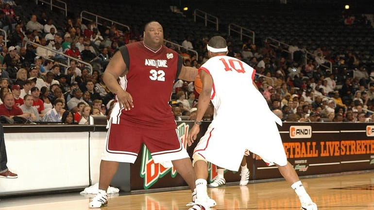 Troy "Escalade" Jackson, left, faces off against Anthony "Half Man,...