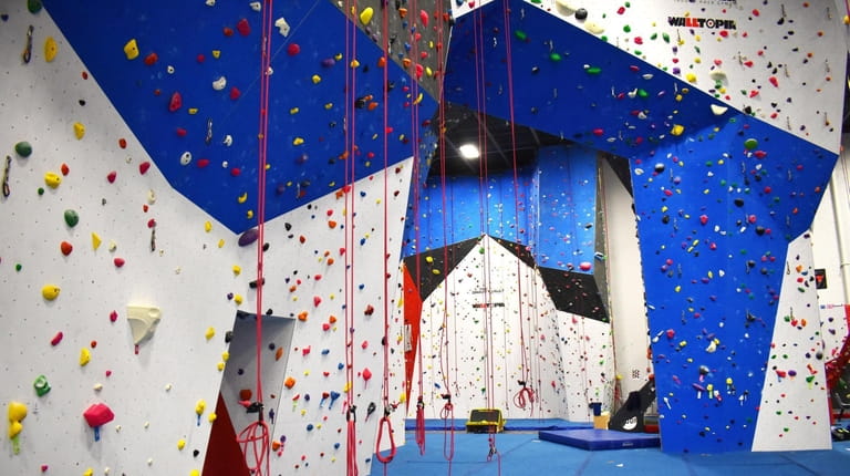The Gravity Vault in Melville, includes an indoor rock climbing...
