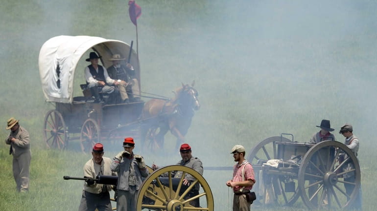 Civil War re-enactors re-create Pickett's Charge on the Bushey Farm...