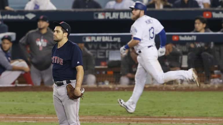 Nathan Eovaldi #17 of the Boston Red Sox watches the...