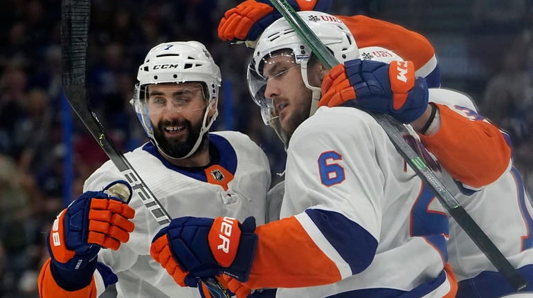 Islanders defenseman Ryan Pulock celebrates his goal against the Lightning with...