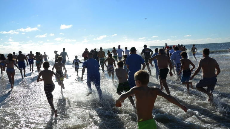 Hundreds take part in the 11th annual Polar Bear Plunge...