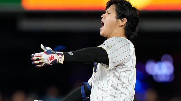 Japan's Shohei Ohtani celebrates after a double during the ninth...