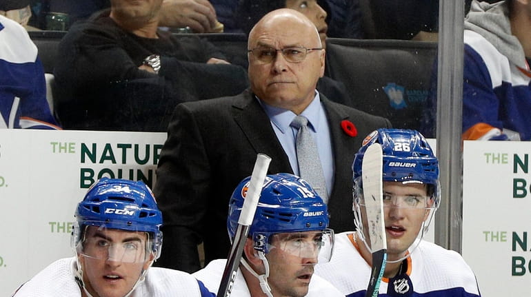 Head coach Barry Trotz of the Islanders looks on during...