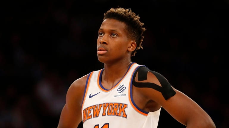 Frank Ntilikina of the Knicks looks on against the Pacers...