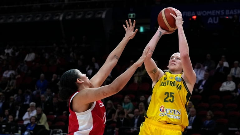 Australia's Lauren Jackson shoots over Canada's Natalie Achonwa during the...