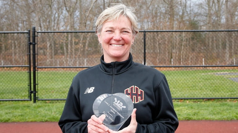 Half Hollow Hills district athletic director Deb Ferry poses for...