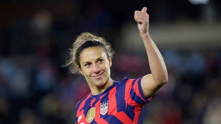 United States' forward Carli Lloyd salutes fans after a soccer...