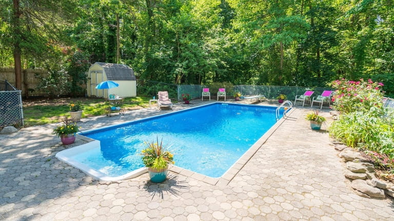 This charming five-bedroom, two-bath expanded Cape with a pool on...