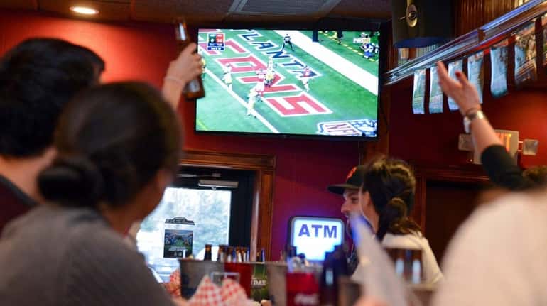 Football fans can watch the Super Bowl on numerous televisions...
