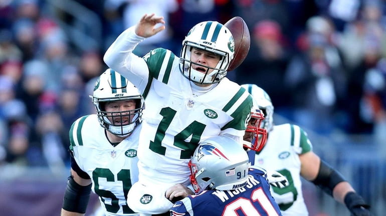 Sam Darnold #14 of the New York Jets loses the...