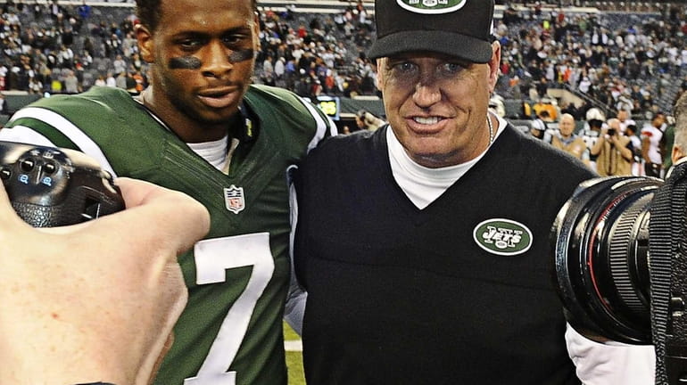 Geno Smith Rex Ryan pose for photos after beating the...