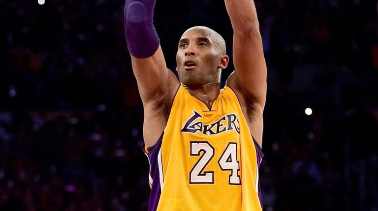 Kobe Bryant of the Lakers takes his final shot - a...