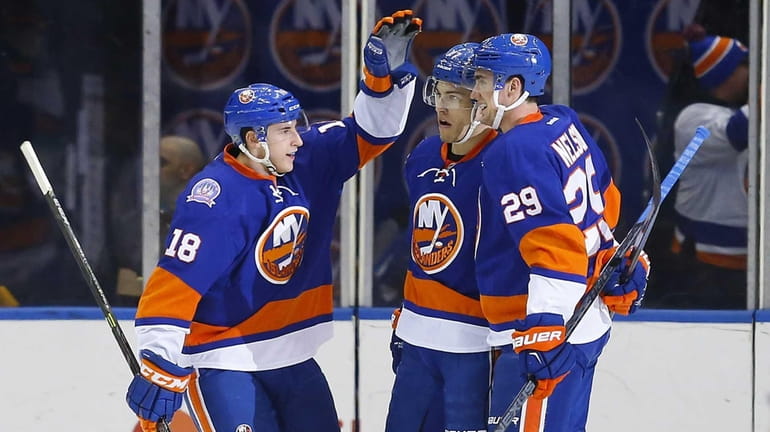 Anders Lee #27 of the New York Islanders celebrates his...
