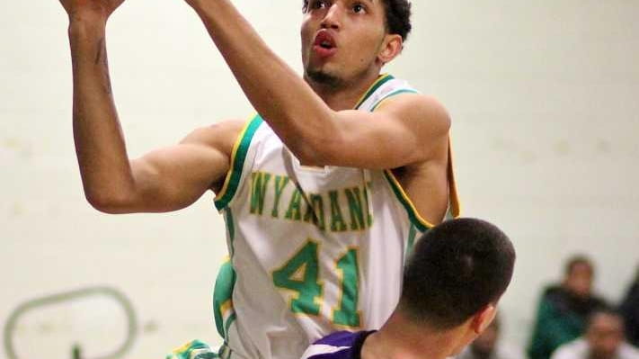 Wyandanch's Alex Williams drives the lane for two points. (Jan....