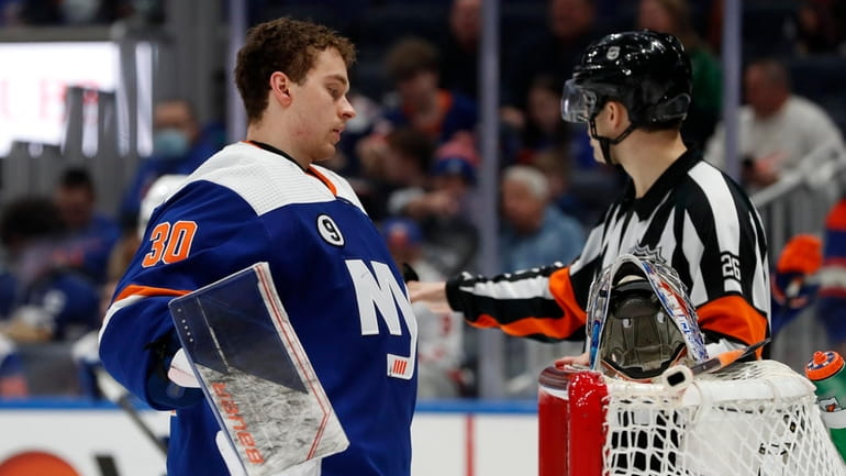 Ilya Sorokin of the New York Islanders pauses during the...