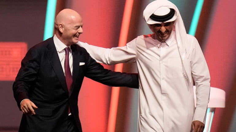 FILE - FIFA President Gianni Infantino, left, and Emir of...