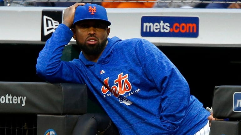 Jose Reyes of the Mets looks on during the first...