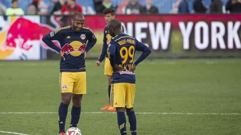 Red Bulls' Thierry Henry, left, and Bradley Wright-Phillips react as...