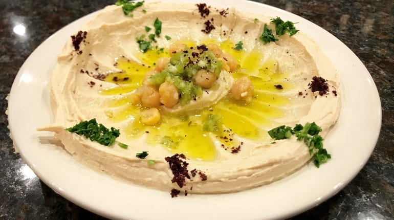 Hummus is a menu highlight at Petra Grill, a new...