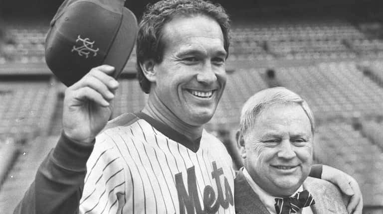 Gary Carter poses at Shea Stadium with Mets GM Frank...