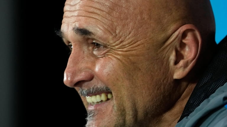 Napoli's head coach Luciano Spalletti answers reporters during a news...