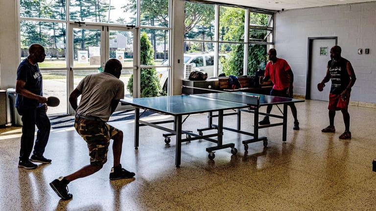 A doubles table tennis pickup match at Kennedy Memorial Park...