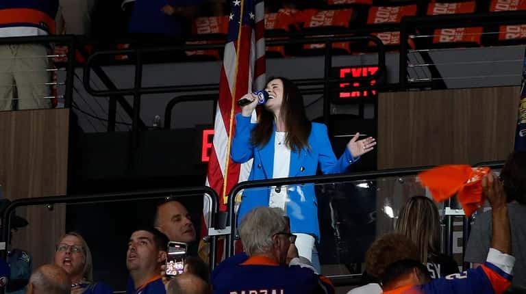 Nicole Raviv sings the national anthem before Game 6 of...