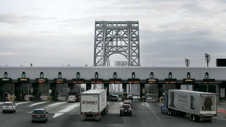 Cars approach the toll booth at the George Washington bridge...